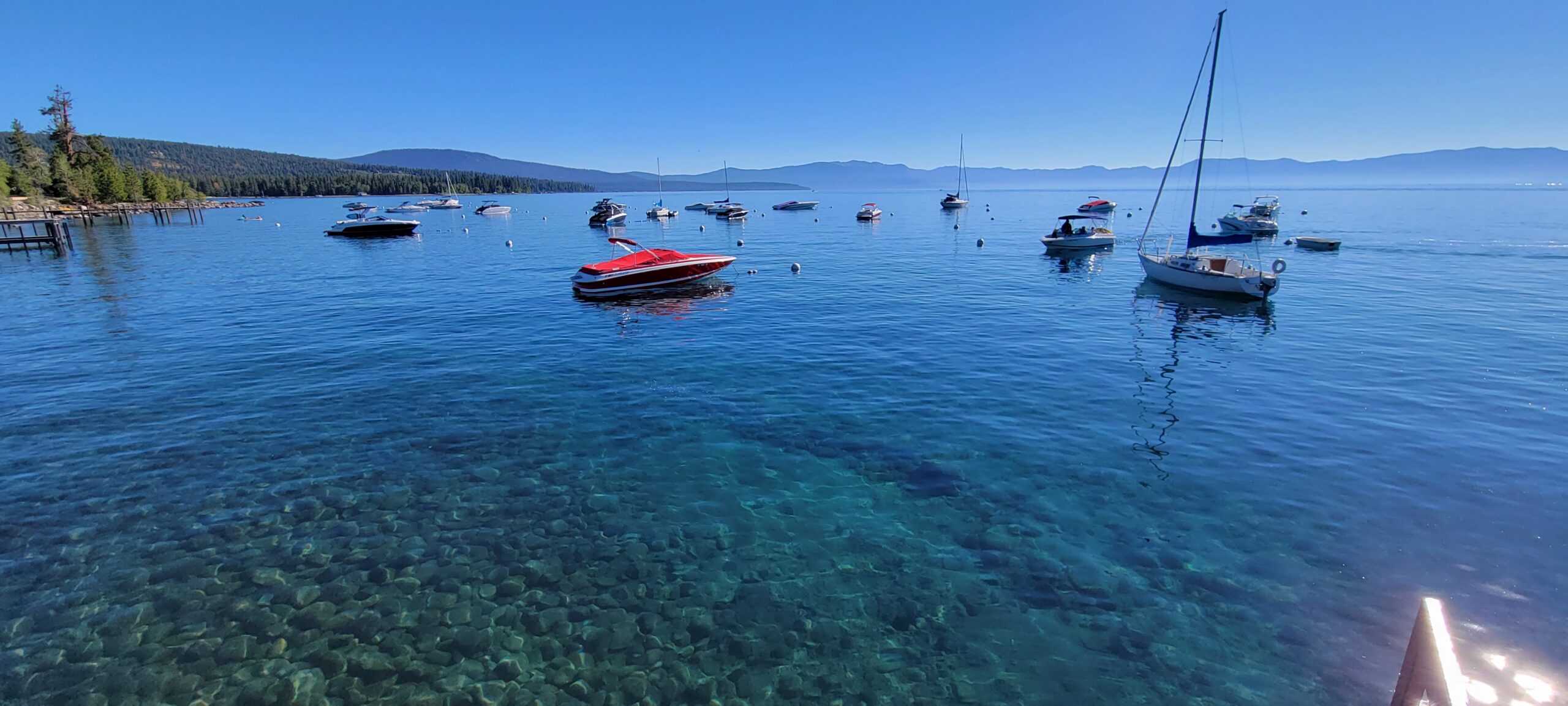 Boat rentals on Lake Tahoe with mountains in the background
